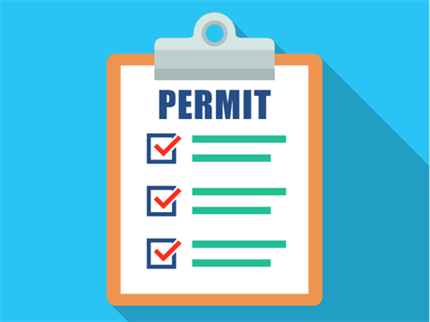 Cartoon drawing of a permit on a clipboard with checked boxes. 