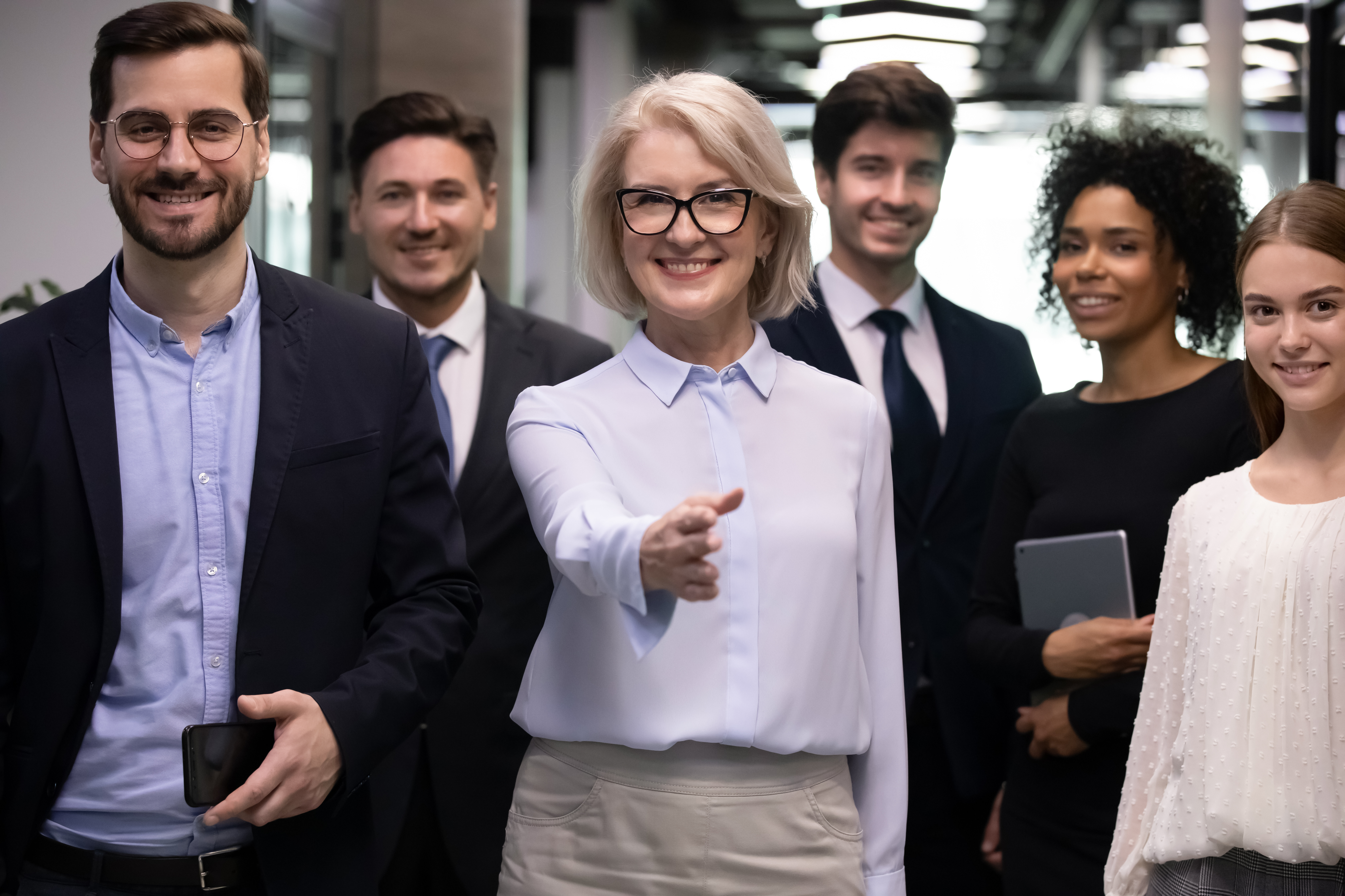 Diverse group with center person holding an outstretched hand .jpeg