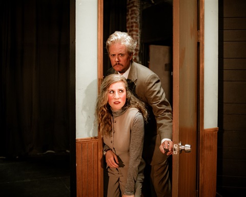 Actors on stage in Black Coffee