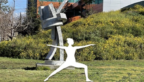 Yoga figure in front of West LA College Building