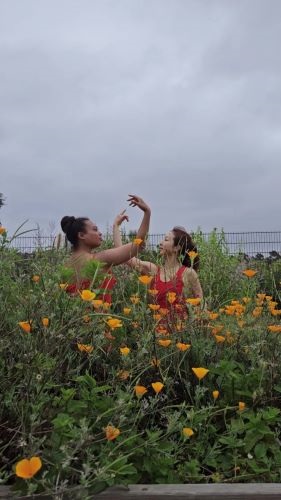 Dancers Colleen Hendricks and Hyosun Choi with Flowers 