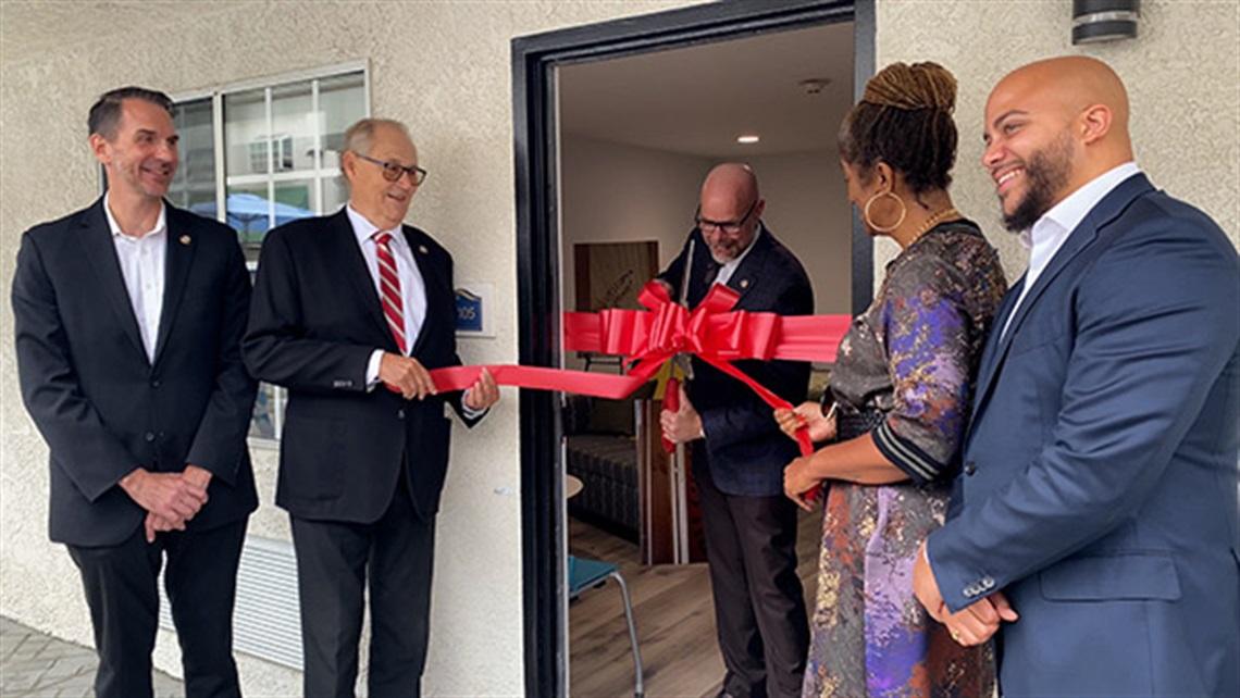 Project Homekey ribbon cutting photo with civic leaders