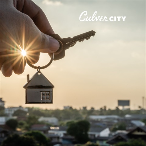 Photo of hand holding key over skyline with Culver City logo