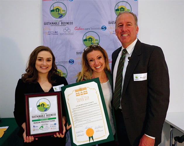 Council Member Alex Fisch presenting Sustainable Certificate to Rekon Productions