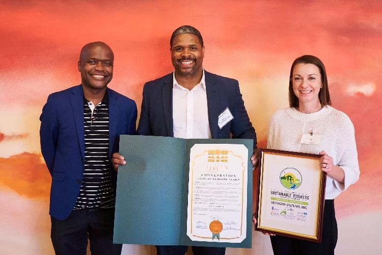 Photograph of Mayor Daniel Lee and representatives from Servicon receiving Sustainable Business Certificate at event June 2022