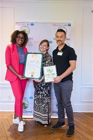 Photograph of Mayor Yasmine-Imani McMorrin celebrating Sustainability Award with the Wende Museum