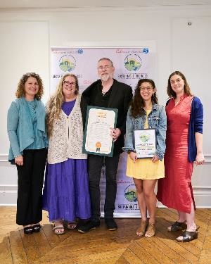 Photograph of Susy Borlido of Sustainable Works celebrating Sustainability Award with Branches Atelier 
