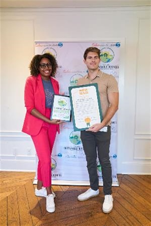 Photograph of Mayor Yasmine-Imani McMorrin celebrating Sustainability Award with Primestor Development