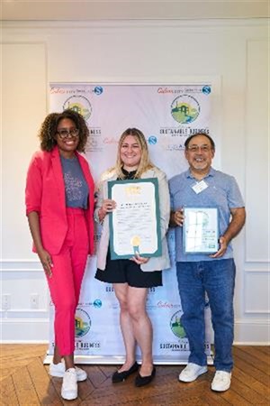 Photograph of Mayor Yasmine-Imani McMorrin celebrating Sustainability Award with Echo Horizon School