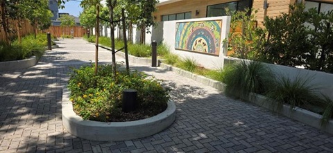 Photograph of newly constructed Farragut Connector pathway, including artwork The Speedway by Sonia Romero, mosaic tile, 2025.