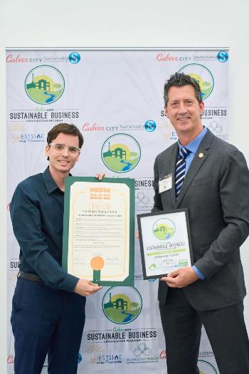 Photograph of Mayor Dan O'Brien presenting ReDiscover Center with 2025 Sustainable Business Certification Award 2025-09-23