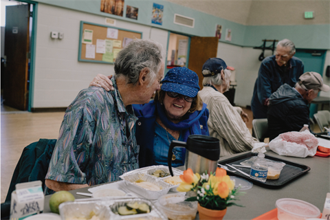 Seniors Embracing and Smiling